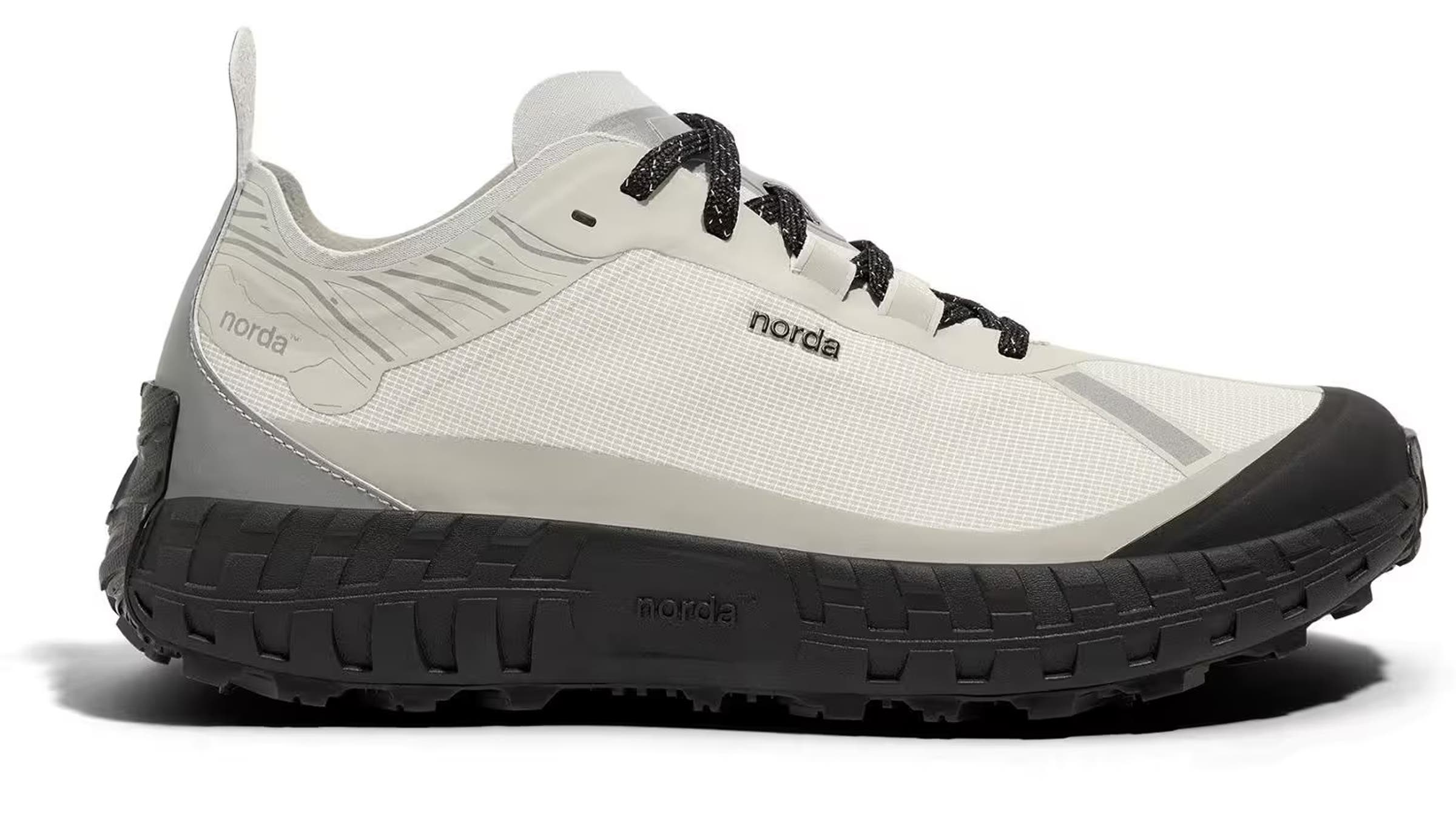 Off-white Norda 001 trail running shoe featuring a black Vibram outsole and speckled laces. Designed for durability, traction, and comfort on rugged fastpacking routes.
